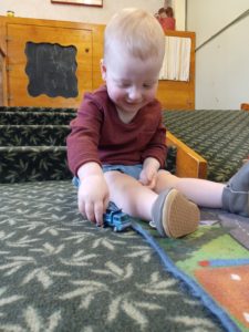 Toddler working with cars